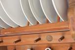 There are quirky details all around - here's a one penny piece set into the plate rack.