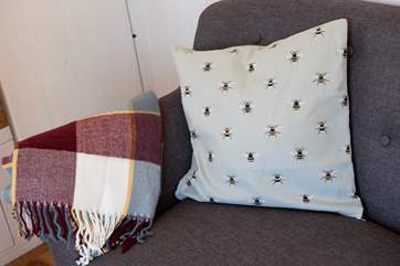 There's a sofa to snuggle up on of an evening.