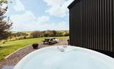 Slip into the bubbling hot tub and enjoy stunning views of rolling countryside - Thumbnail Image