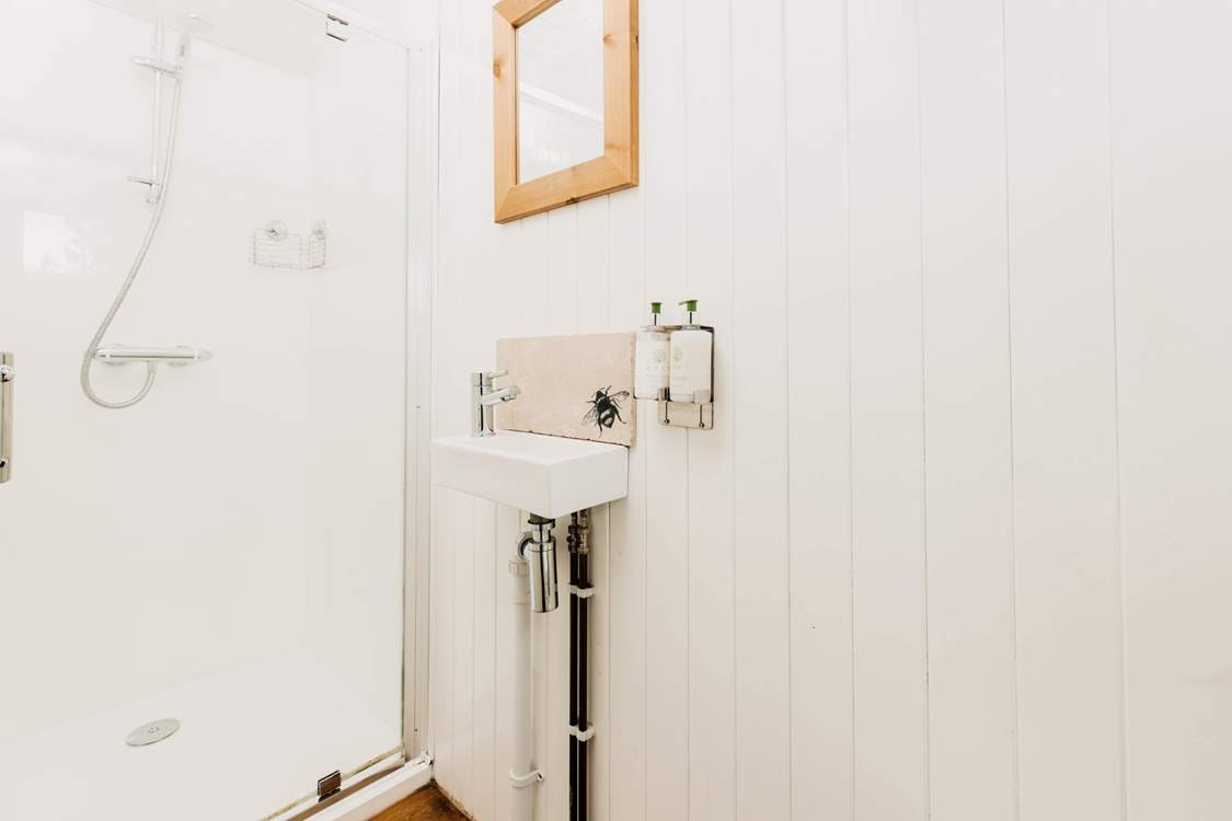 There is a serene ensuite shower room with WC