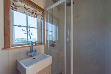 With a walk-in shower, wash-basin and WC.