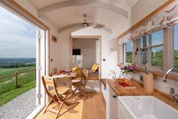 Surprisingly spacious, with a dining area, kitchen and bed area.