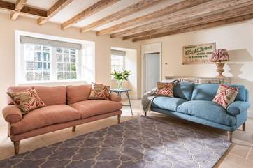 The sitting-room is flooded with natural light.