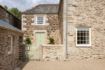 Welcome to Tremayne Farm House. There is a handy side lean-to perfect for storing wetsuits and surfboards.