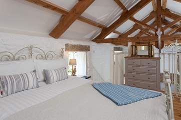 The mezzanine bedroom has a super-comfy bed and oozes romance.