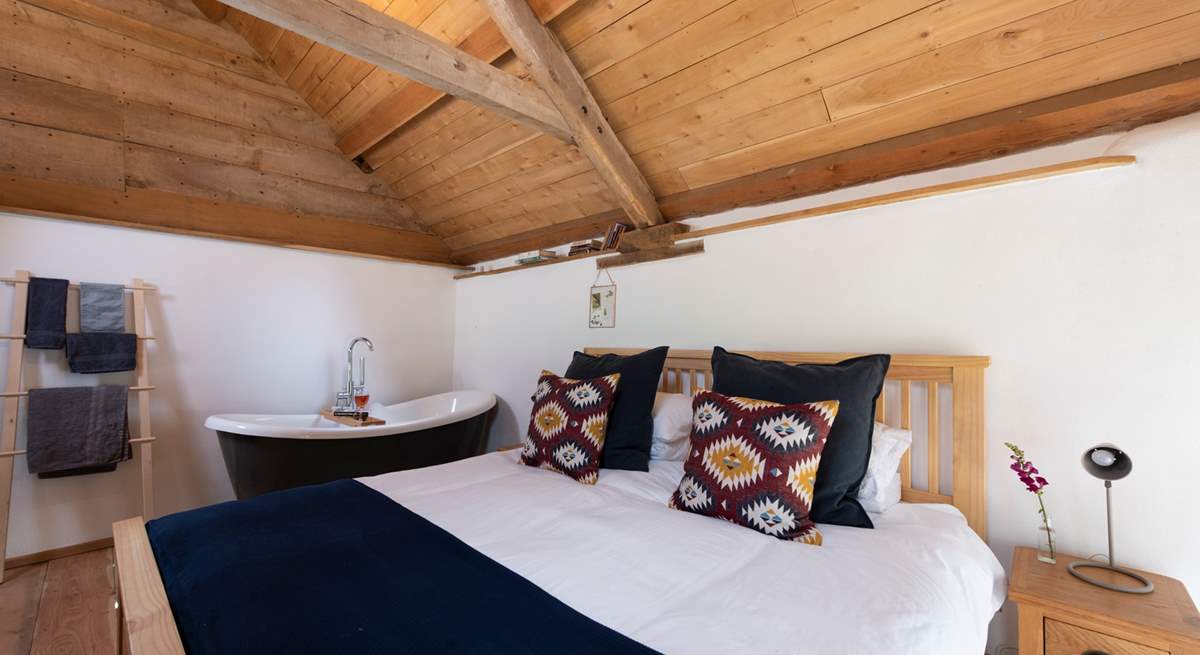 The bedroom with king-sized bed is a welcoming space for a restorative break.