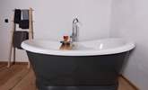 Sit back and relax in the roll-top bath - with a glass of wine and book in hand.  - Thumbnail Image