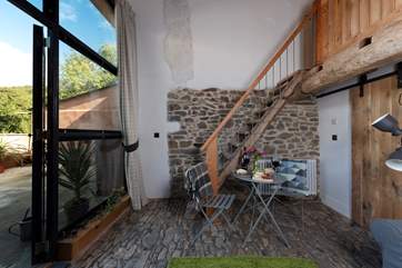 A staircase leads up to the mezzanine level - please take care with the narrow-treaded steps.