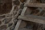 The ladder stairs are protected by a carved wooden panel, reclaimed long ago from a local church (please take care when using them, as the steps have a narrow tread).