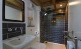 The chic shower room is just the spot for freshening up after a day of adventures.  - Thumbnail Image