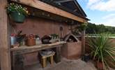 Not only is there a Kamado (barbecue and ceramic smoker) but there's a wood-fired pizza oven too! - Thumbnail Image