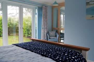 Doors lead out from the bedroom to your private garden.