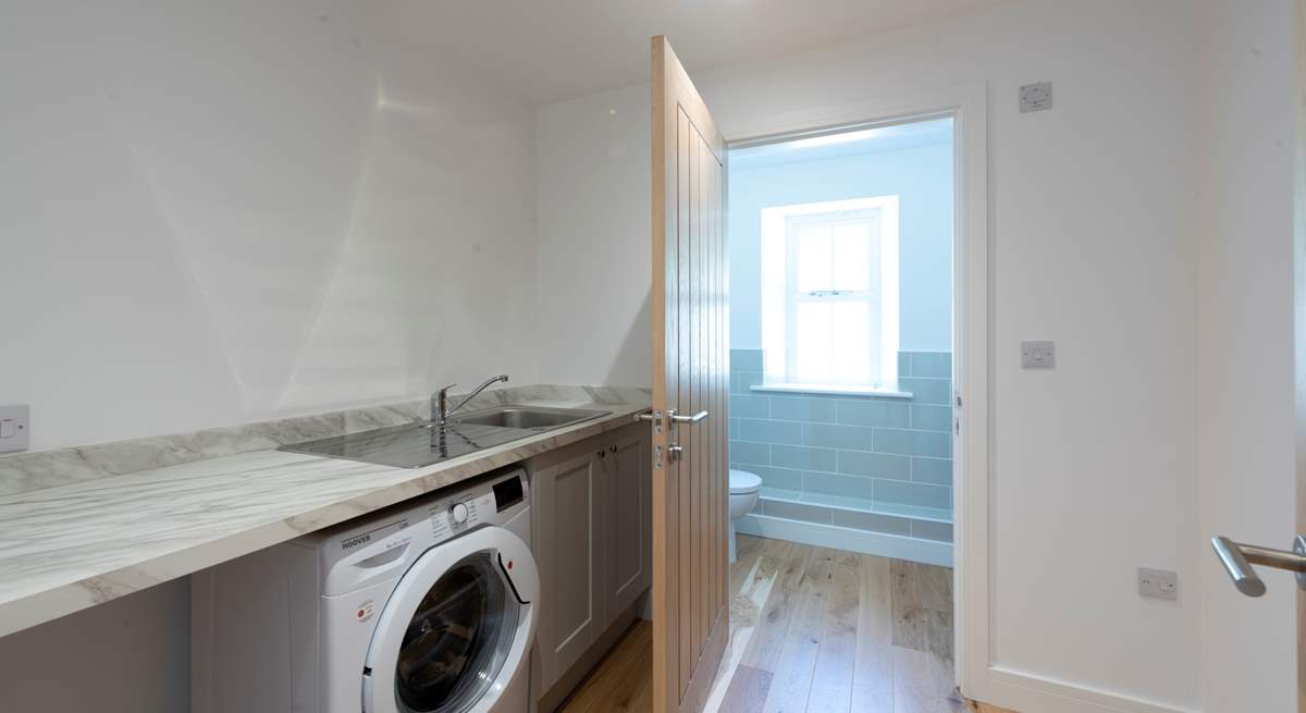 The utility-room leads to a cloakroom on the ground floor.