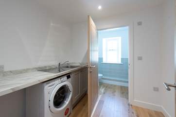 The utility-room leads to a cloakroom on the ground floor.