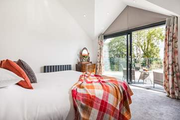 Enjoy watching swallows swooping outside your bedroom.