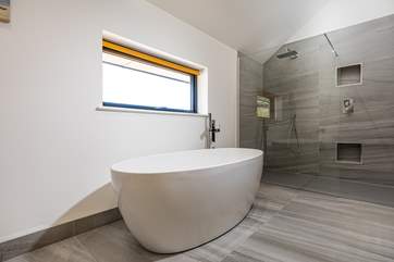 Enjoy a good soak in the large bath in the en suite bathroom.