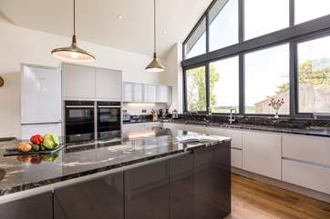 The kitchen has a stunning island and is a lovely place to cook.