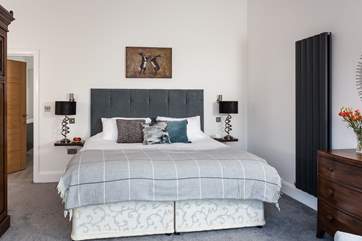 The master bedroom has an eclectic mix of furniture (Bedroom 1).