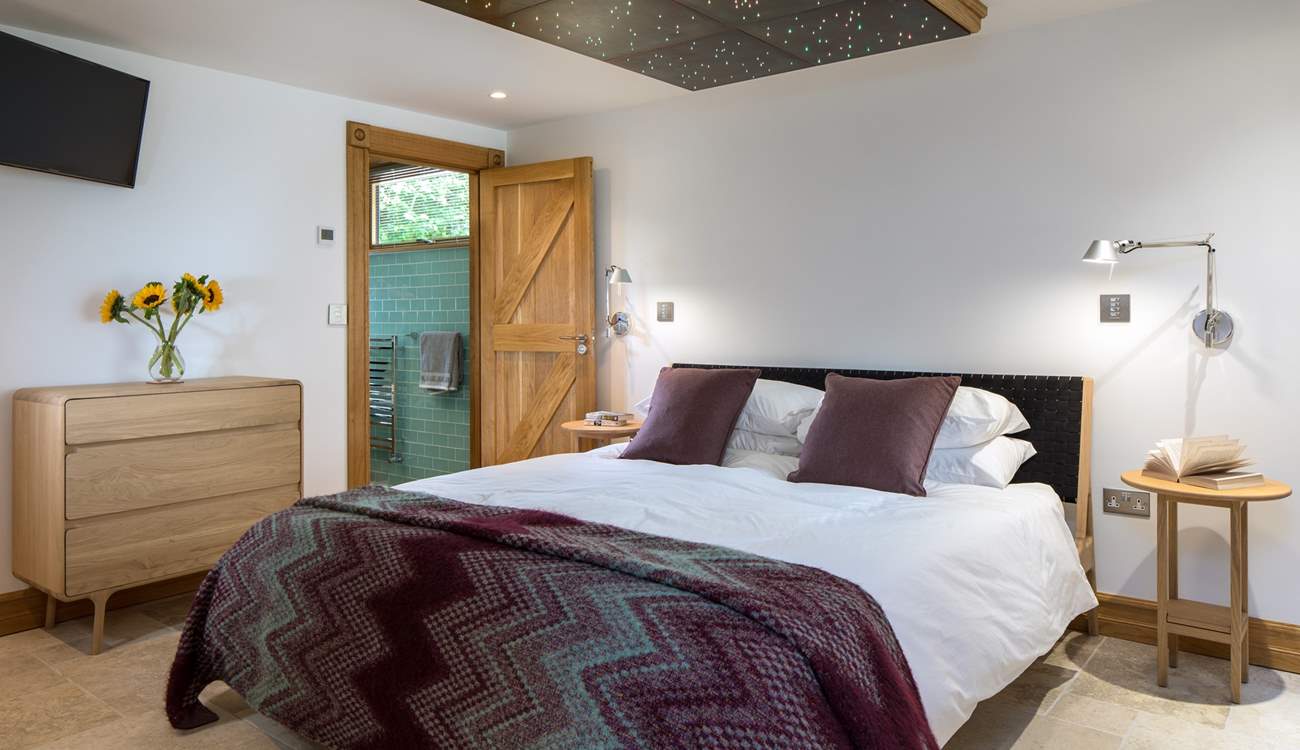 Bedroom 1 boasts a rather unique ceiling lighting feature. The colour changing lights help set the perfect mood.