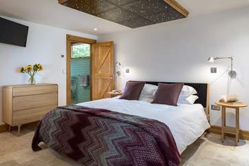 Bedroom 1 boasts a rather unique ceiling lighting feature. The colour changing lights help set the perfect mood.