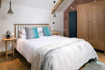 Bedroom 3 boasts this super inviting king-size bed.