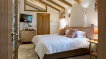 Bedroom 2 is simply stunning. This super-king size bed can also be converted into two single beds offering extra flexibility. 