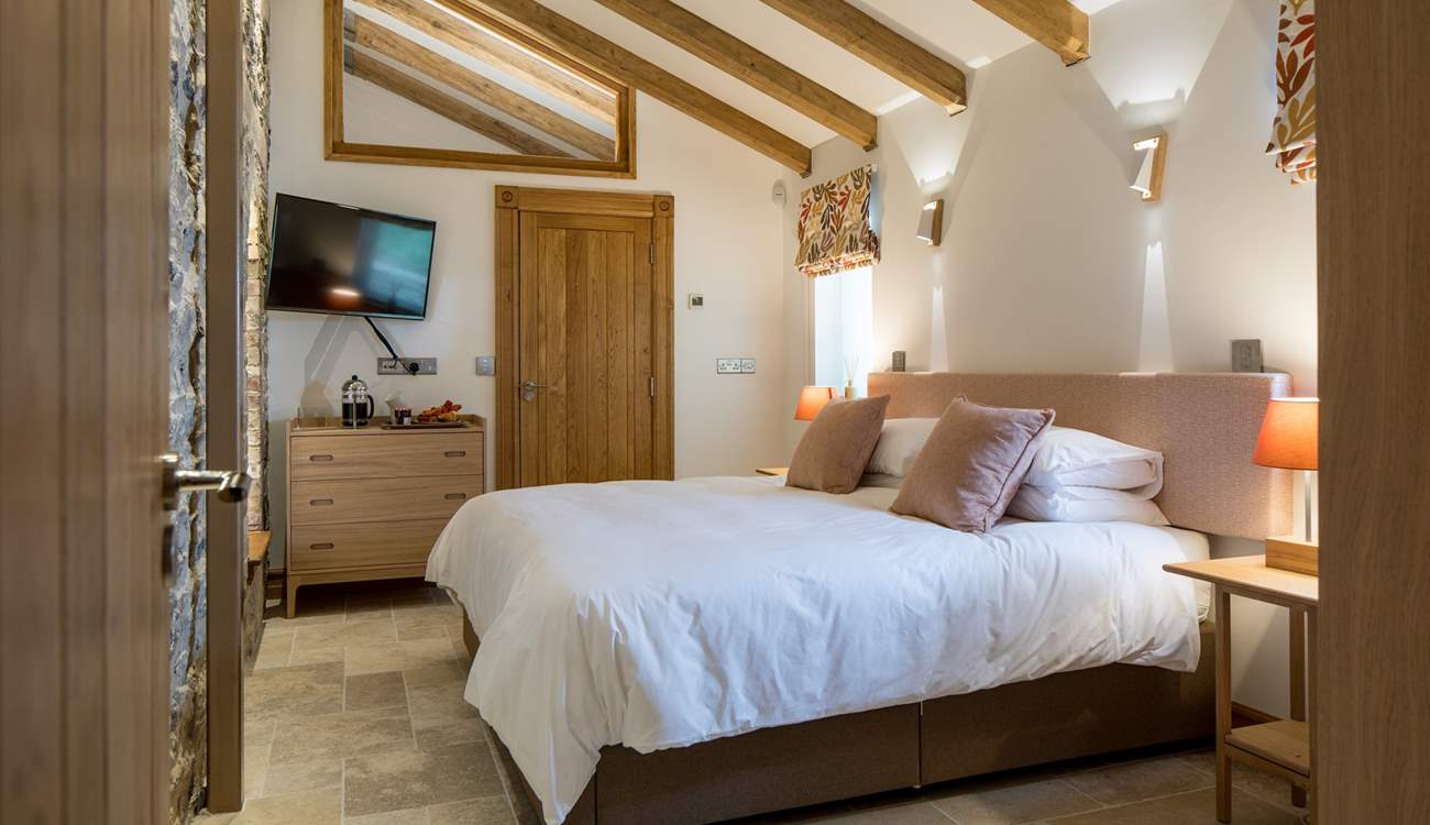 Bedroom 2 is simply stunning. This super-king size bed can also be converted into two single beds offering extra flexibility. 