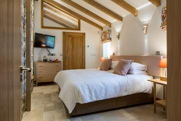 Bedroom 2 is simply stunning. This super-king size bed can also be converted into two single beds offering extra flexibility.