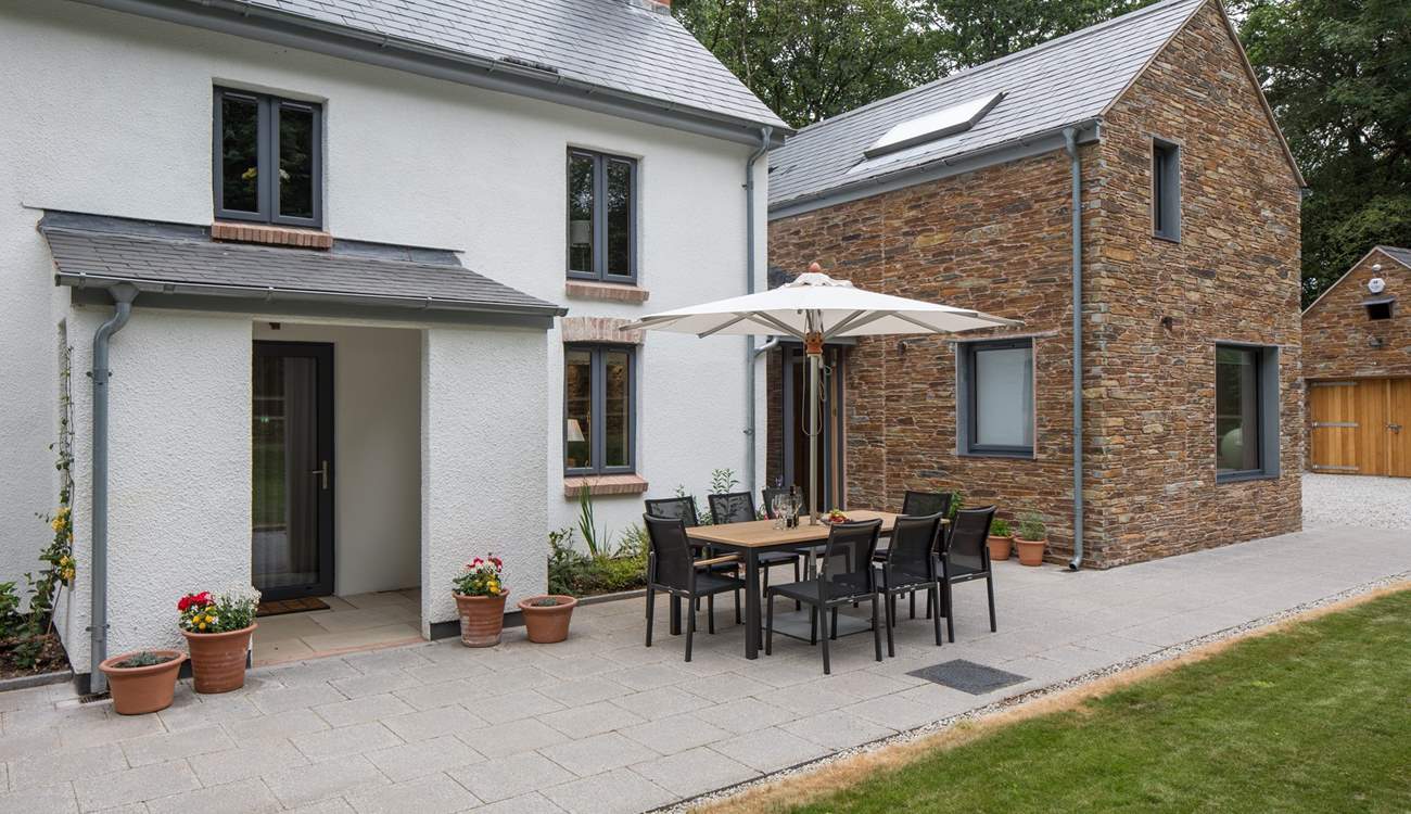 The games-room/garage is neatly tucked away across the driveway (right of shot).