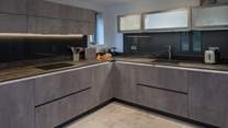 This beautiful kitchen is wonderfully equipped, offering everything you could possibly need to whip up that special meal.