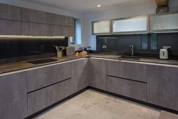 This beautiful kitchen is wonderfully equipped, offering everything you could possibly need to whip up that special meal.
