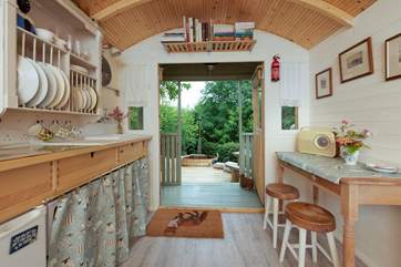 There's a small kitchen as well as a sweet dining area.