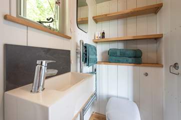 Complete with flushing WC, heated towel rail and small sink.