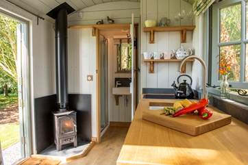 A warming wood-burner ensures year-round cosiness.