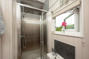 With walk-in shower cubicle, WC and wash-basin.