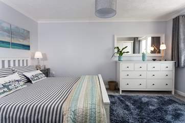 The master bedroom has a gorgeous king-size bed.