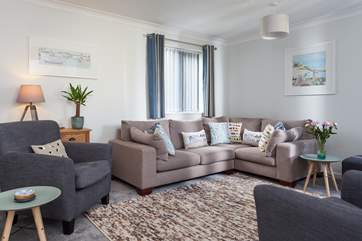 The sitting-room has a fabulous corner sofa to snuggle up on.