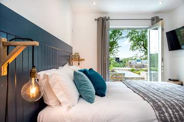 Again doors lead out to the garden area - each bedroom also has the luxury of a TV.