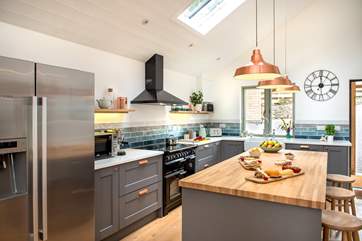 The stylish kitchen is so well-equipped and has a range-style cooker, American-style fridge/freezer and coffee machine.