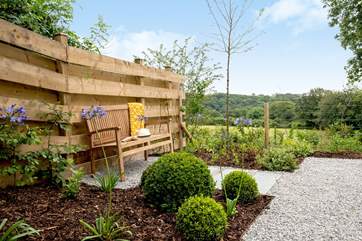 A lovely place for a spot of holiday reading amongst the agapanthus and roses.