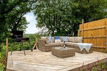 The lounge seating-area on the decking, the perfect spot to fire up the barbecue.