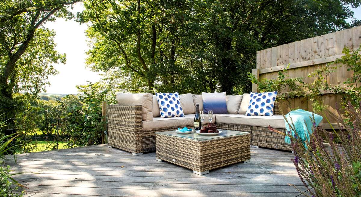 The lounge seating-area on the decking, the perfect spot to fire up the barbecue.