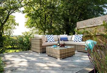 The lounge seating-area on the decking, the perfect spot to fire up the barbecue.
