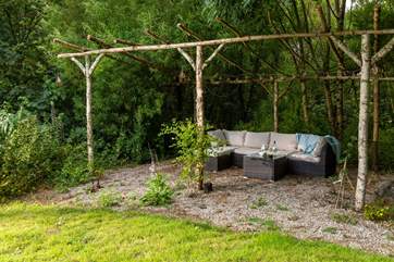 Enjoy the evening sun tucked away, surrounded by woodland.
