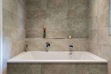 Relax in the bath listening to the peaceful surroundings.