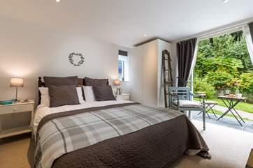 The master bedroom has patio doors which lead out onto the grounds (Bedroom 1).
