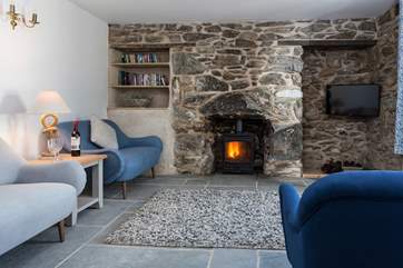 The sitting-room has a cosy wood-burner to snuggle up in front of, perfect for those chillier evenings.