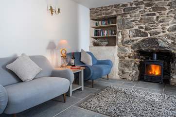 The cosy sitting-room has lots of comfy seating.