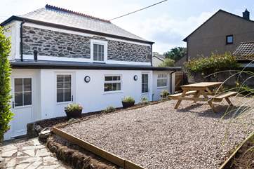 Parc Place has an outside rear patio area (accessed up four steps). This area is private, however located behind Parc Place is a Shepherd's Hut which will be available to book via Classic Cottages at a later date.