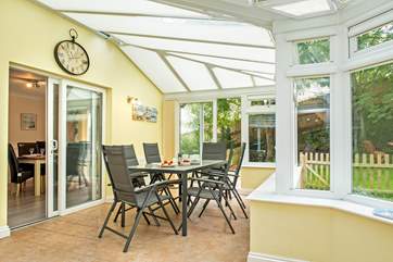 The conservatory is a lovely place to enjoy holiday meals or simply to unwind and relax whilst the children play in the garden.